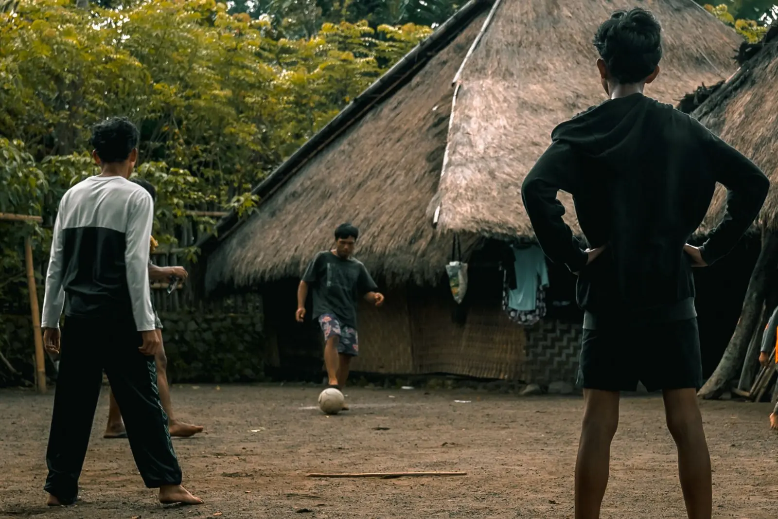Local children playing football in Senaru Traditional Village