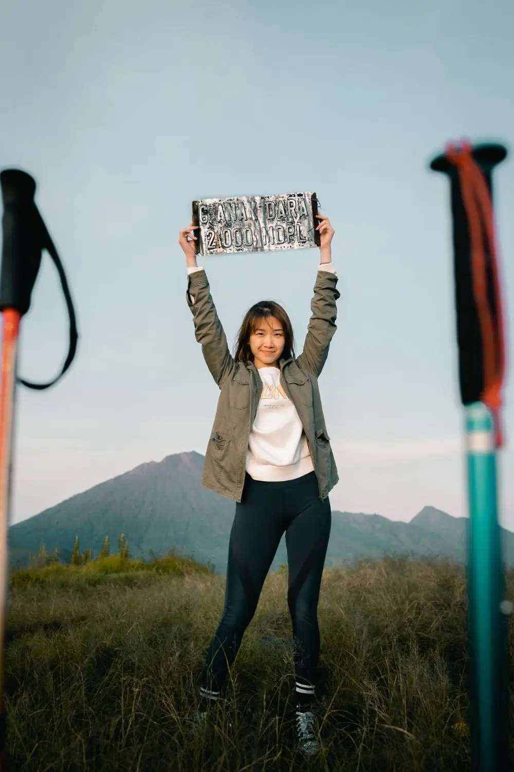 Student stands on the summit of Anak Dara hill in Lombok